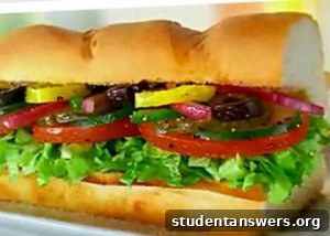 A person holding a delicious 6-inch Subway sandwich, ready to eat.
