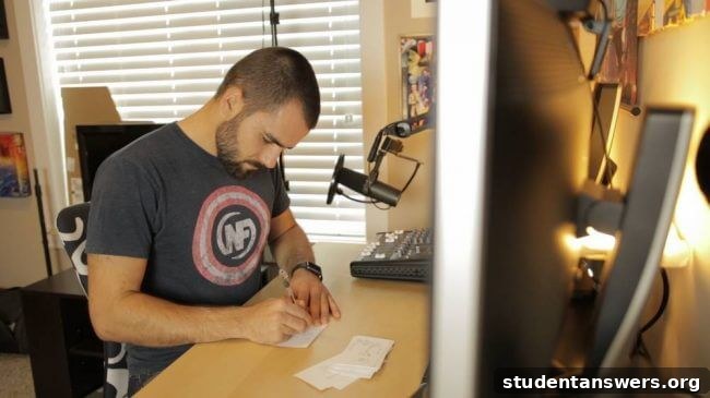 A student actively writing their own flashcards on a desk.