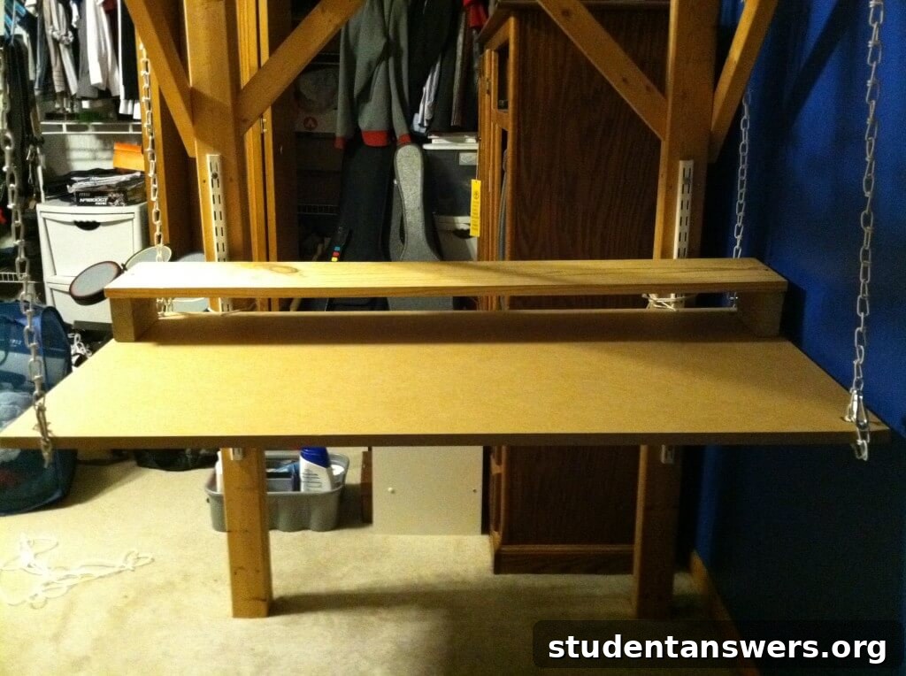 The completed hanging desk with a dual-monitor setup, keyboard, and mouse.