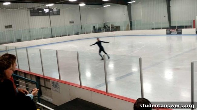 A figure skater performing a move on the ice