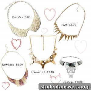 A gold and black statement necklace with intricate beading