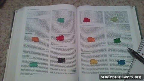 Gummy bear candies placed on an open textbook, representing small study rewards.
