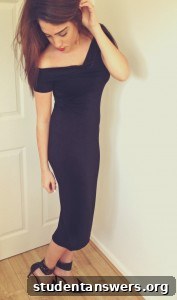Side profile showcasing the midi length of the black dress.