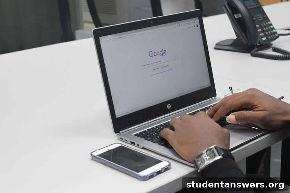 Hands typing on a laptop, crafting a professional cover letter to send with a resume.