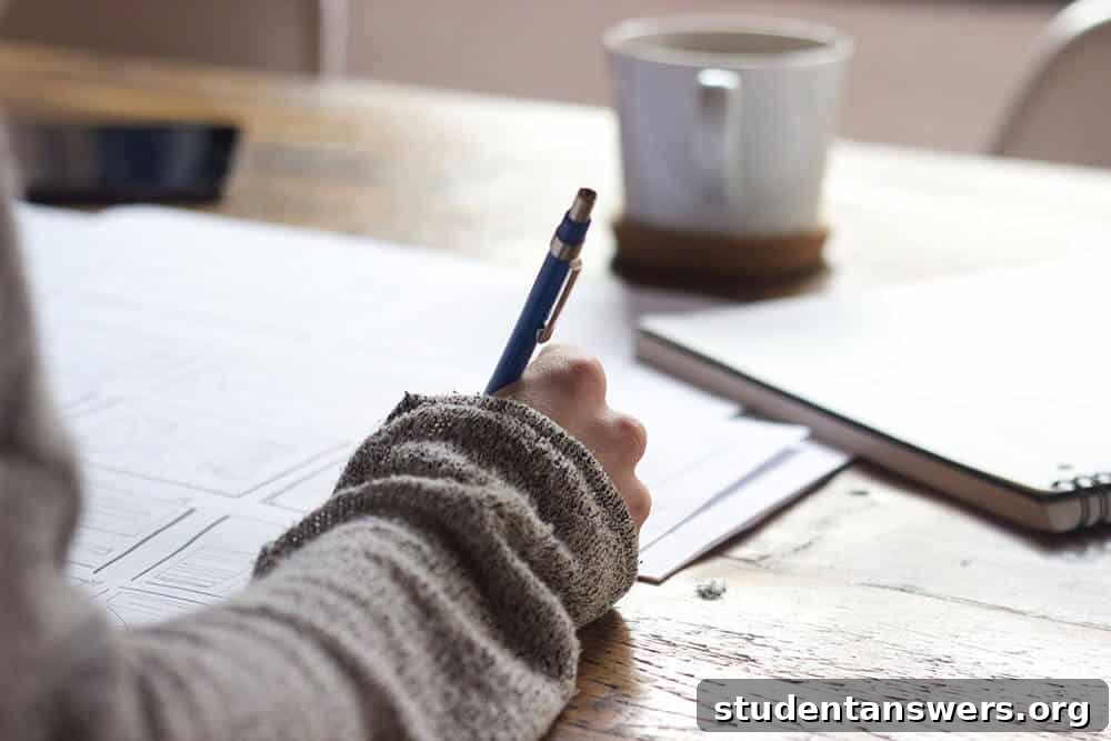 A person writing thoughtful content for their job application on a piece of paper, next to a cup of coffee.