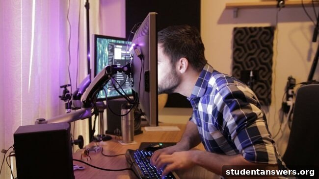 Man focused on working at his computer, illustrating flow-state dehydration