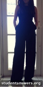 A detailed look at the back of the black jumpsuit, highlighting the open-back design.