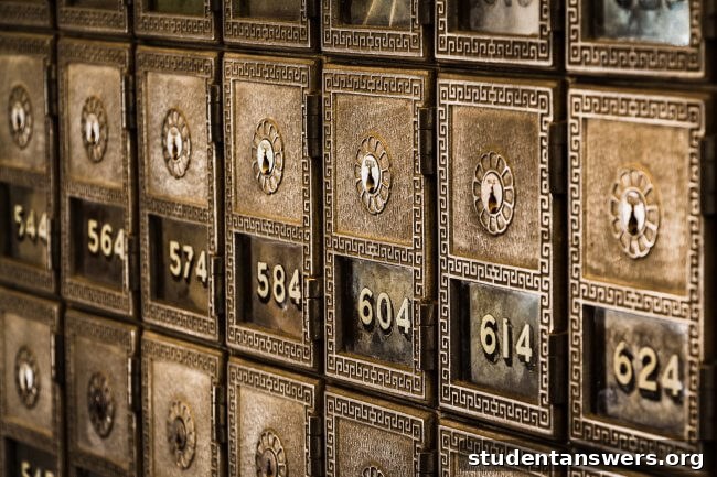 A row of metal mailboxes in an apartment building