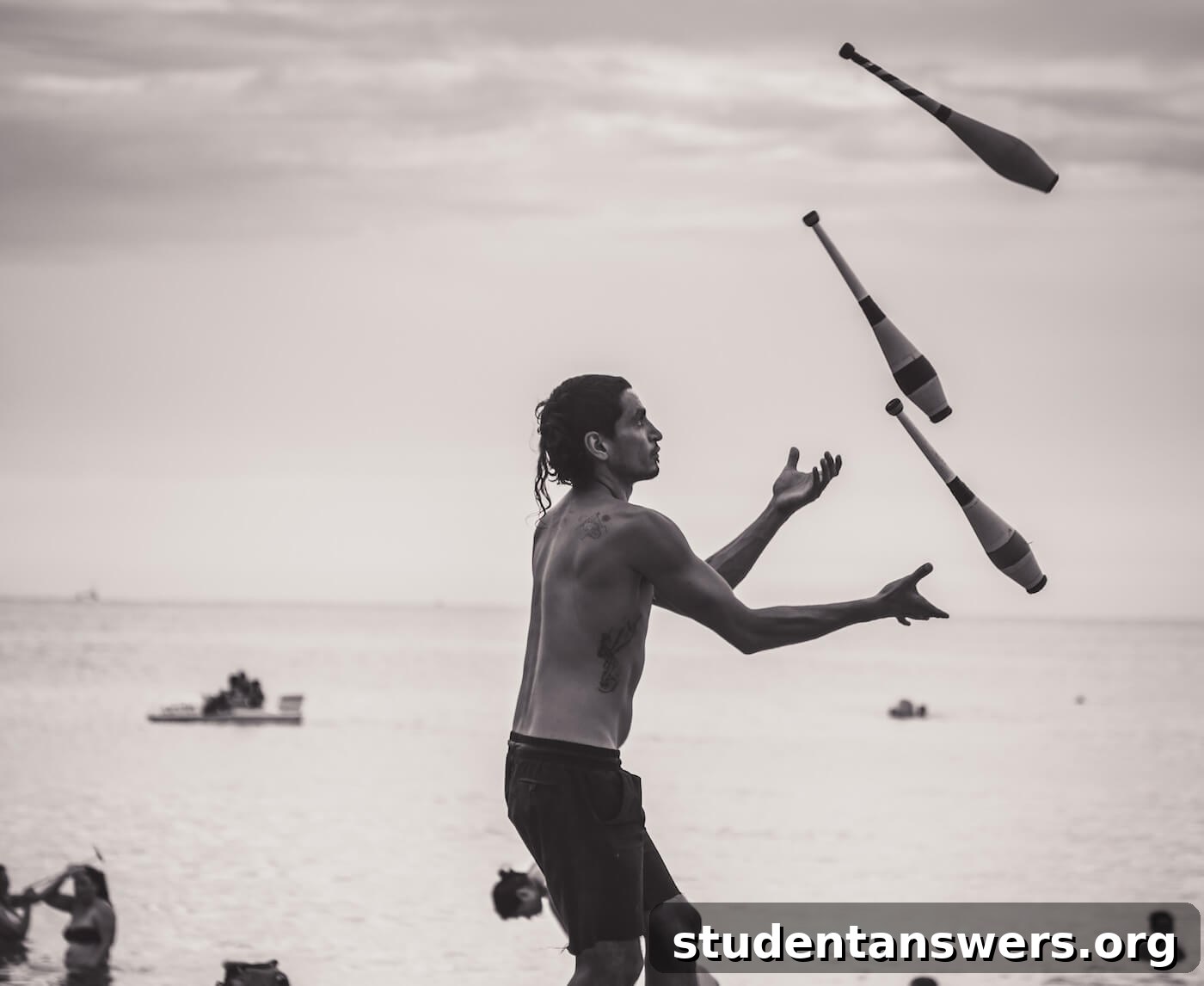 A person juggling balls on a beach, symbolizing the struggle of multitasking