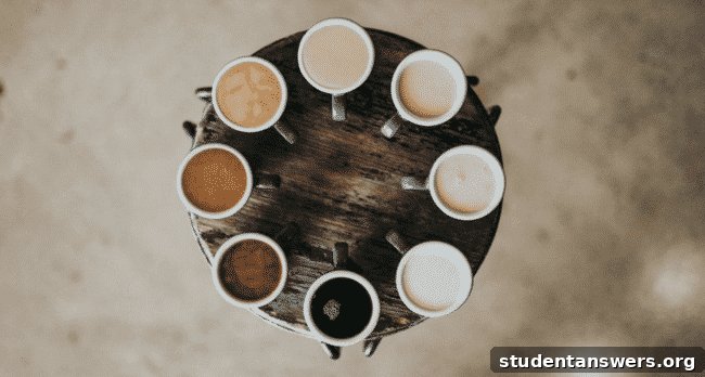 A person reaching for a cup of coffee, illustrating the start of a habit loop.