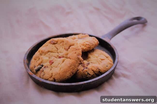 A skillet of warm chocolate chip cookies, representing an obvious reward that might hide a deeper craving.