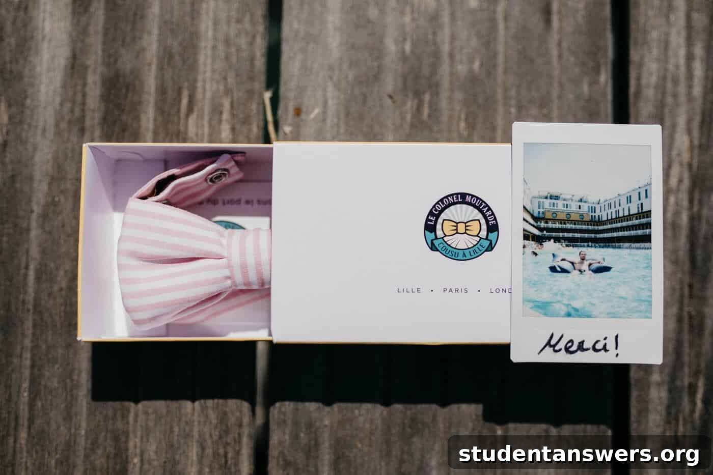 A neatly packaged bowtie in a box, symbolizing a polished final touch.