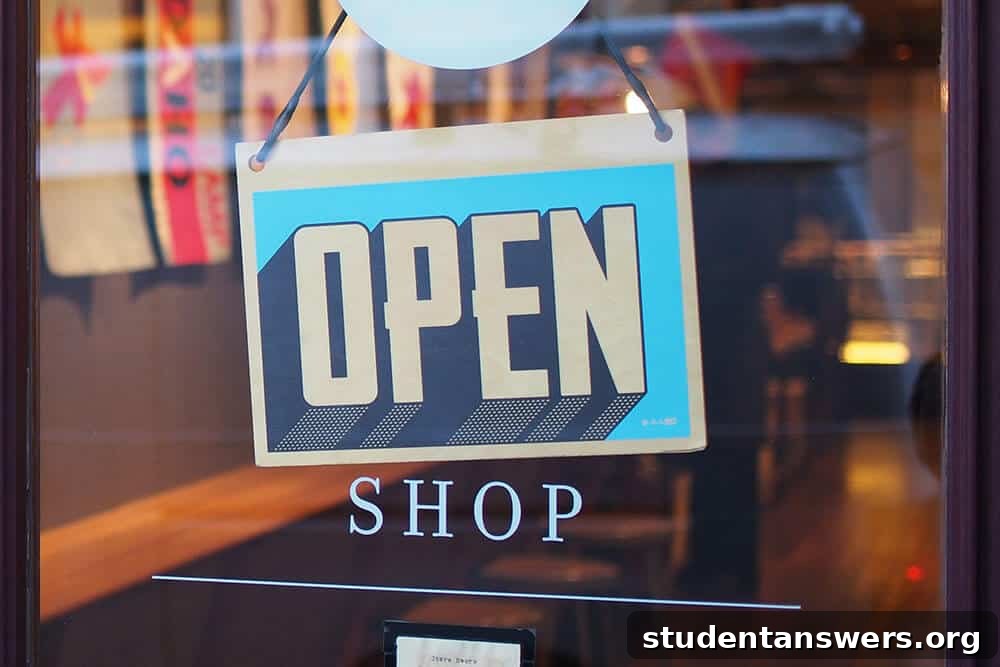 A neon 'open' sign in a shop window, inviting students to find shopping discounts.