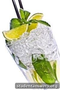 A mixed drink with a lot of ice and a mixer