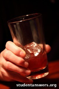 A person drinking a glass of water