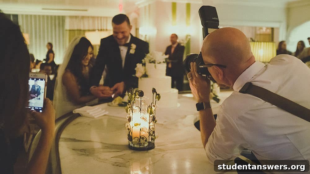 A photographer taking a picture of a couple at their wedding