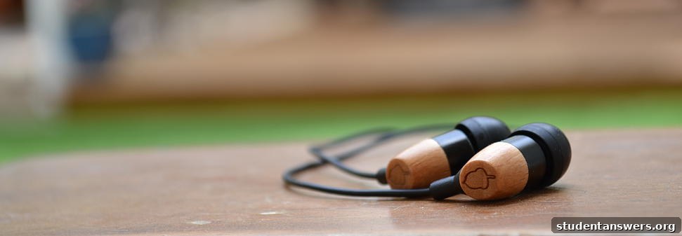 A pair of stylish wooden headphones on a textured background, highlighting sustainable tech.