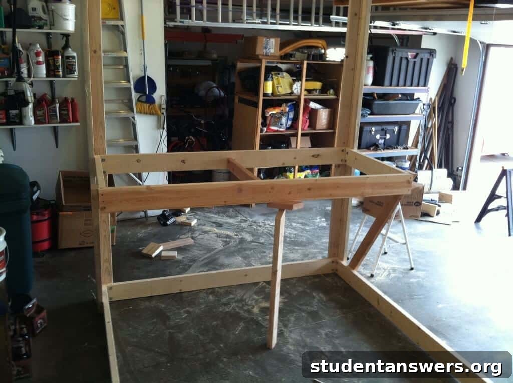 The loft bed frame partially assembled and flipped upside down.