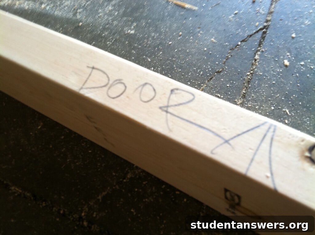 A pencil marking on the wood to label parts for reassembly.