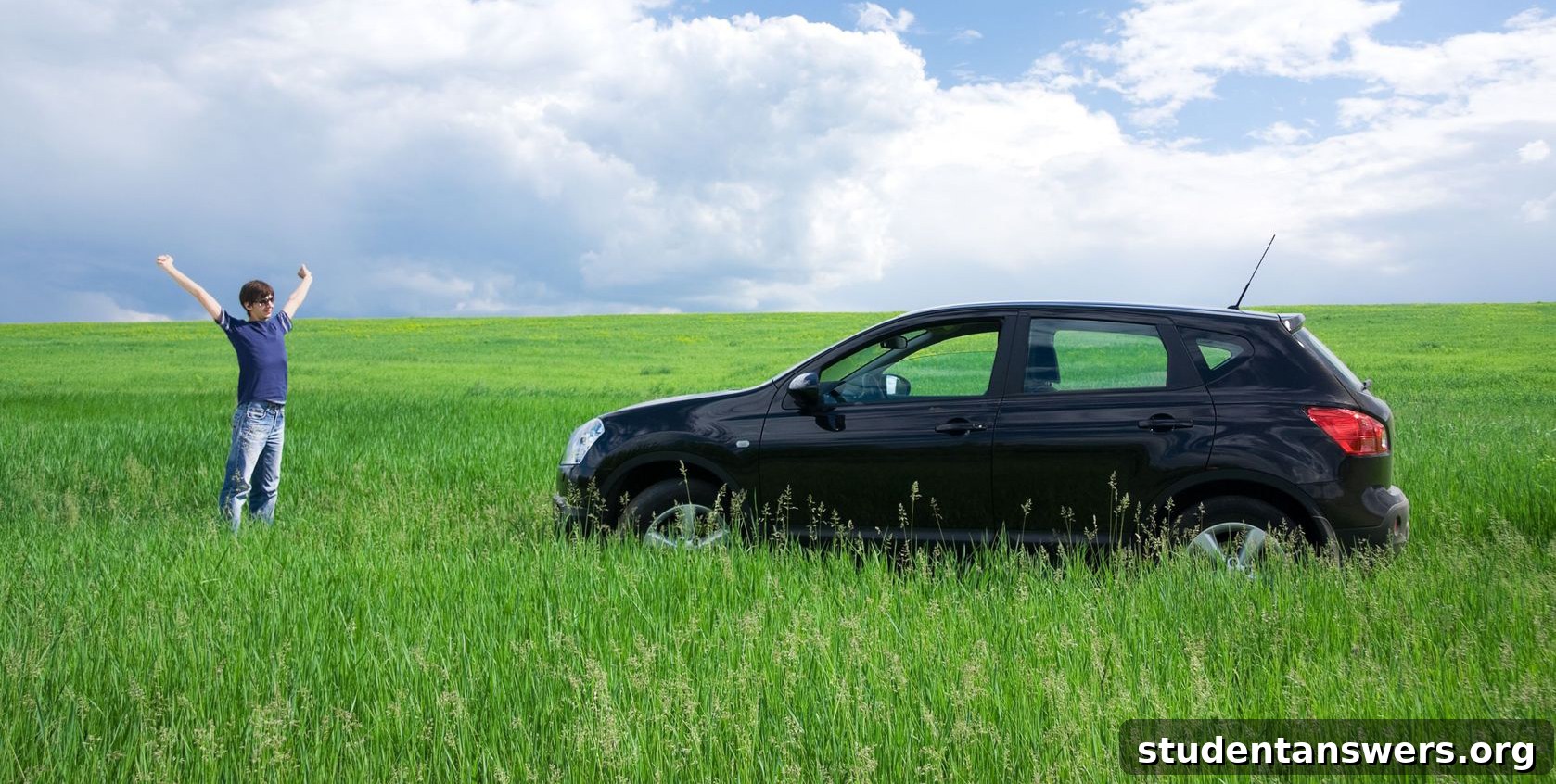 Young driver proudly standing next to their first car