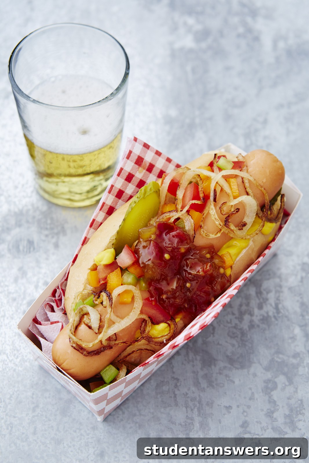 A perfectly assembled Chicago-style hot dog with all the classic toppings in a poppy seed bun.
