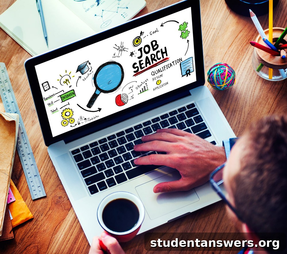 A young student focused on their laptop, actively searching for job and career opportunities online.