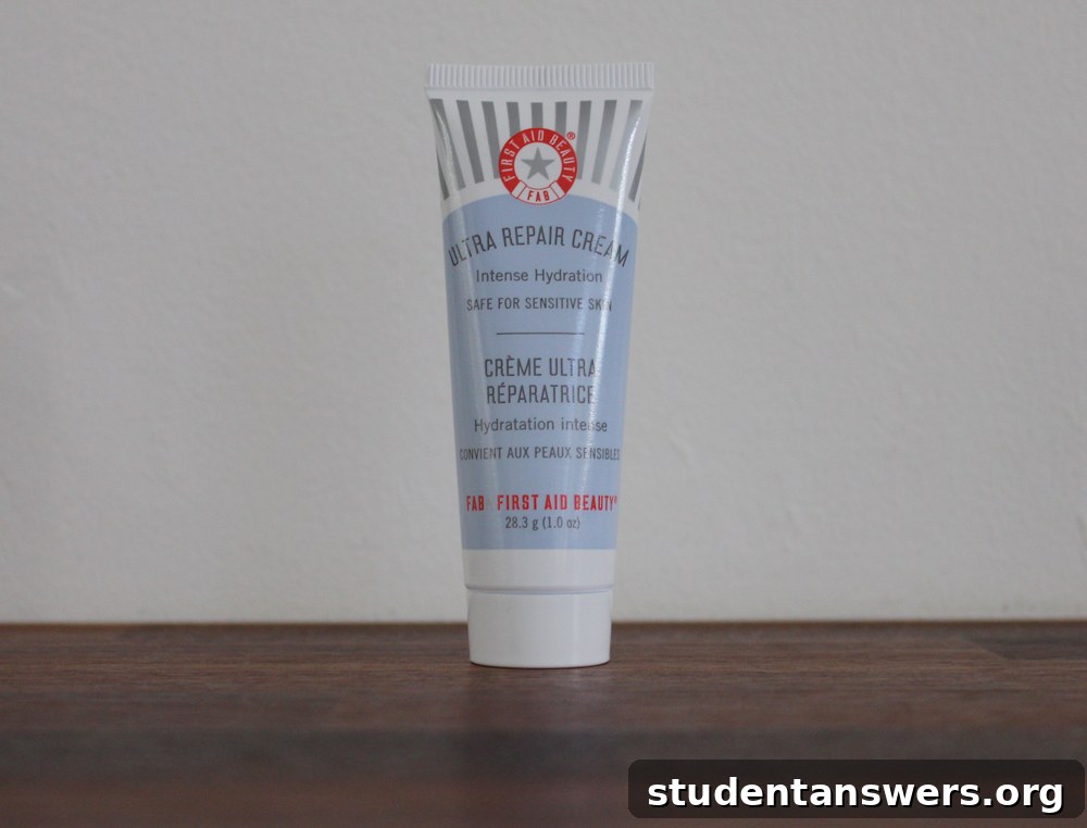 A white tube and tub of First Aid Beauty Ultra Repair Cream