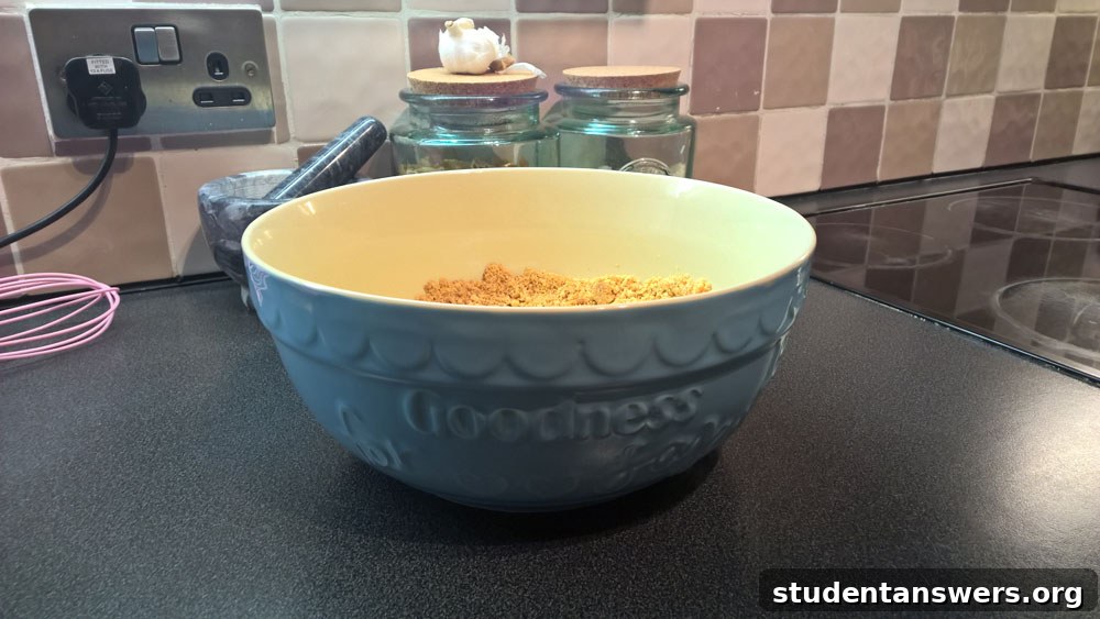 The large, stylish blue mixing bowl from the Aldi Bake Off range, sitting on a wooden countertop.