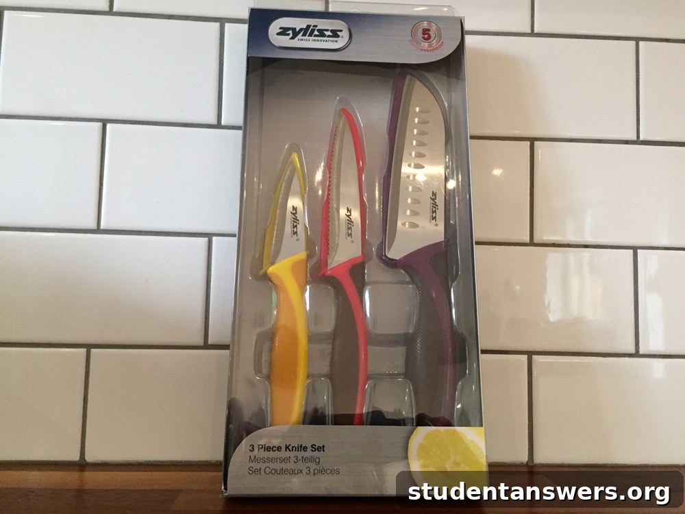 A colourful three-piece set of sharp kitchen knives with blade covers
