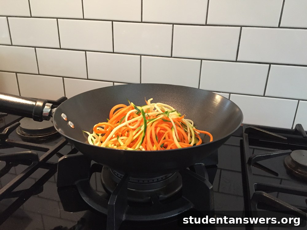 A delicious vegetable stir-fry with spiralized carrots in a non-stick wok