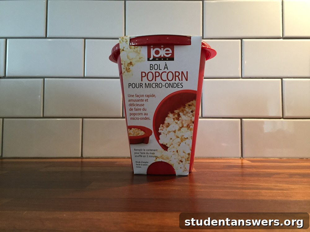 A bright red microwave popcorn maker, perfect for a student movie night