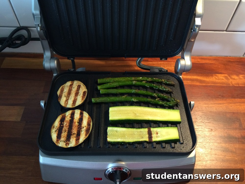 Perfectly grilled vegetables cooking on an electric indoor grill