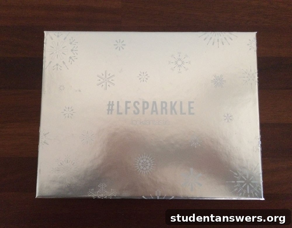The Lookfantastic #LFSPARKLE November beauty box surrounded by its seven beauty products.