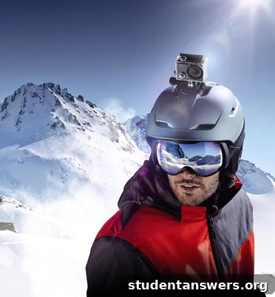 A skier holding the Aldi Action Camcorder on a sunny ski slope, capturing the view.