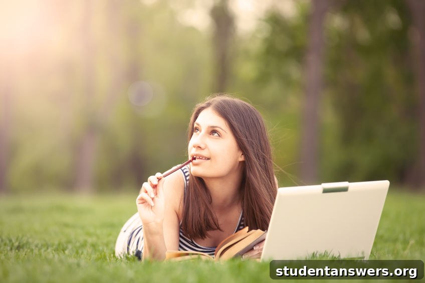 A student writing on a laptop, a great way to make money freelancing