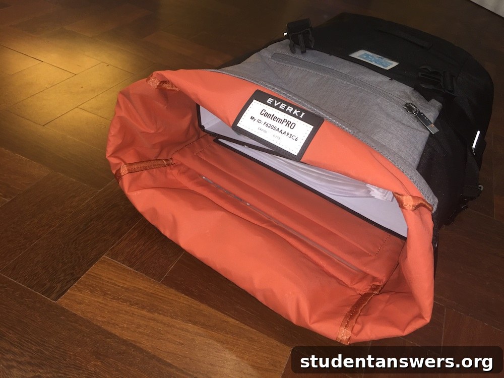 The EVERKI ContemPRO backpack opened up, showing the spacious main compartment and easy access provided by the roll-top design.