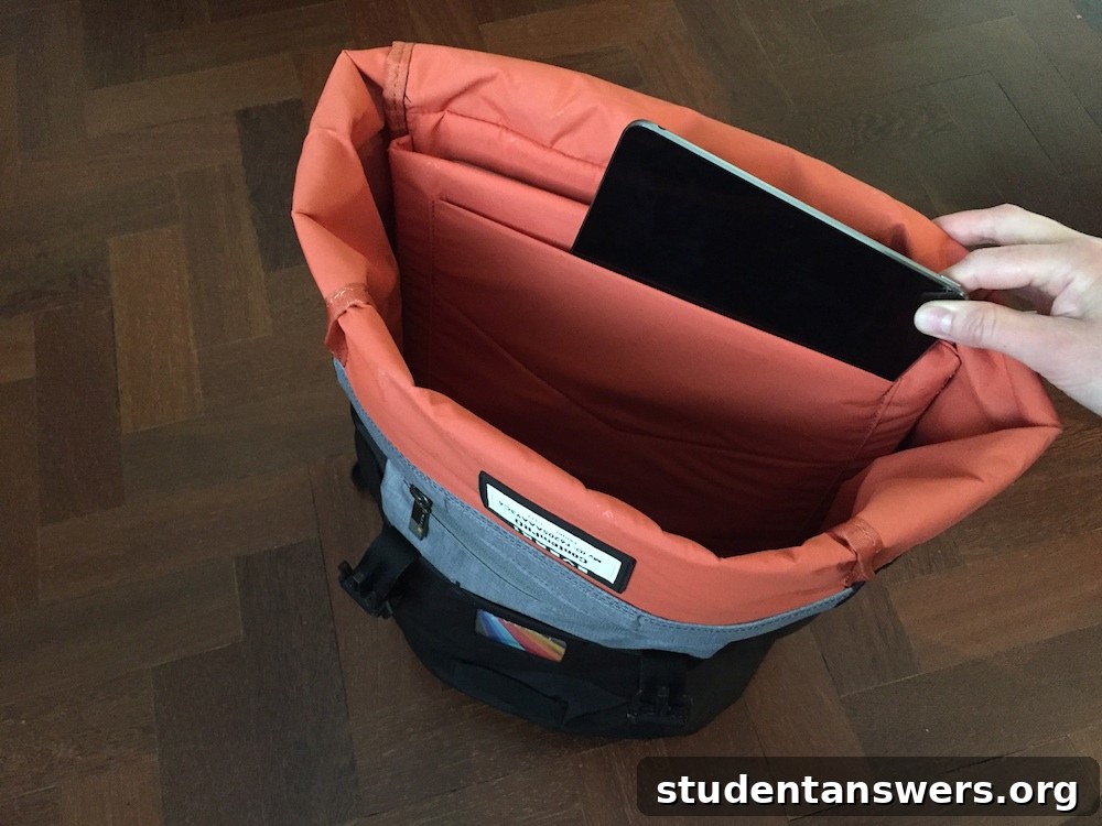 The interior of the EVERKI ContemPRO backpack showing the dedicated padded sleeves for a laptop and an iPad Pro.