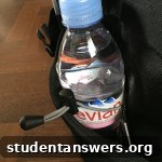 Close-up of the side pocket on the EVERKI backpack, featuring a key clip and a bungee cord for a water bottle.
