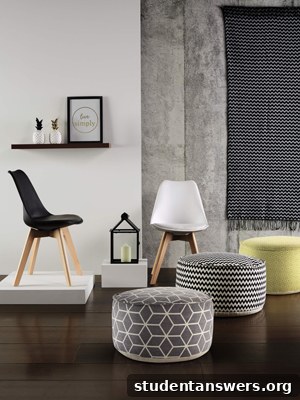 A cozy geometric-patterned throw draped over a chair.
