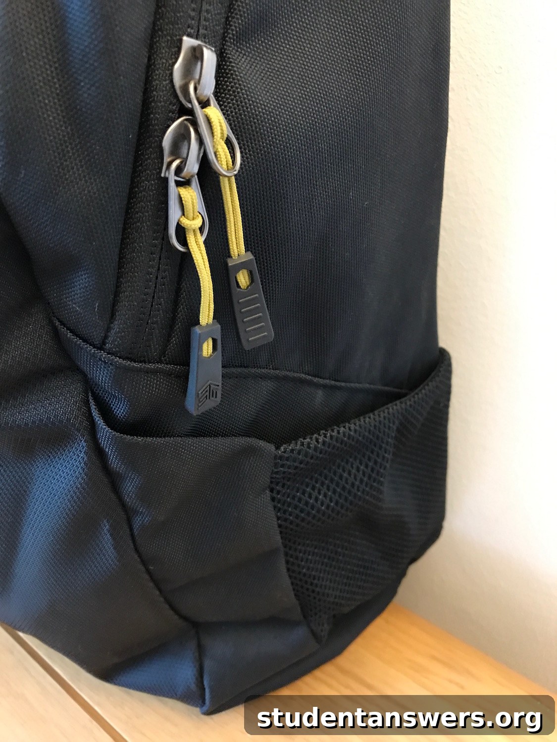 Close-up of the water-resistant reverse coil zippers on the STM Saga backpack