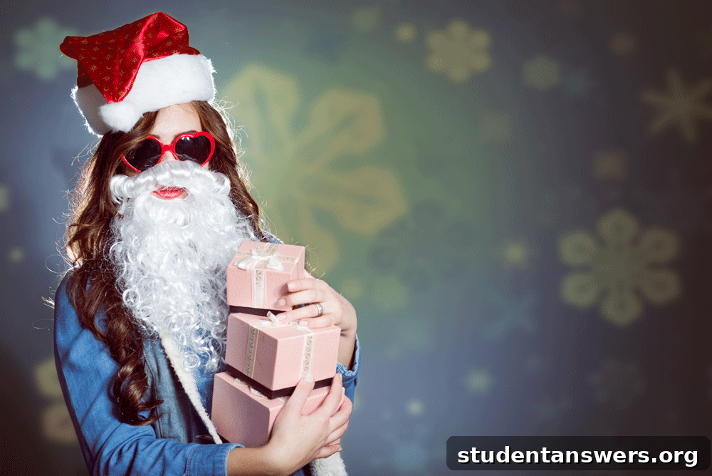 A young woman wearing a Santa hat smiling while wrapping Christmas presents