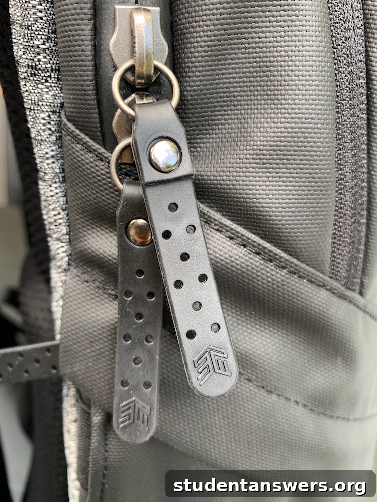 Close-up of the backpack's water-resistant TPU material and zipper